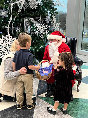 Santa Greeting Children at Love Lights Tree Lighting